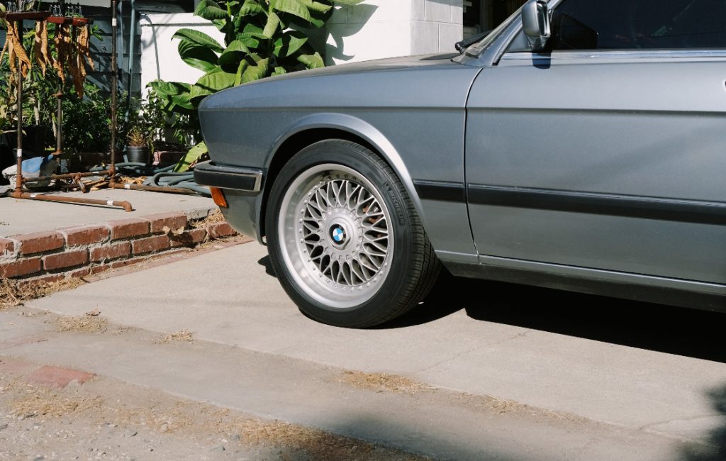 car parked on concrete driveway